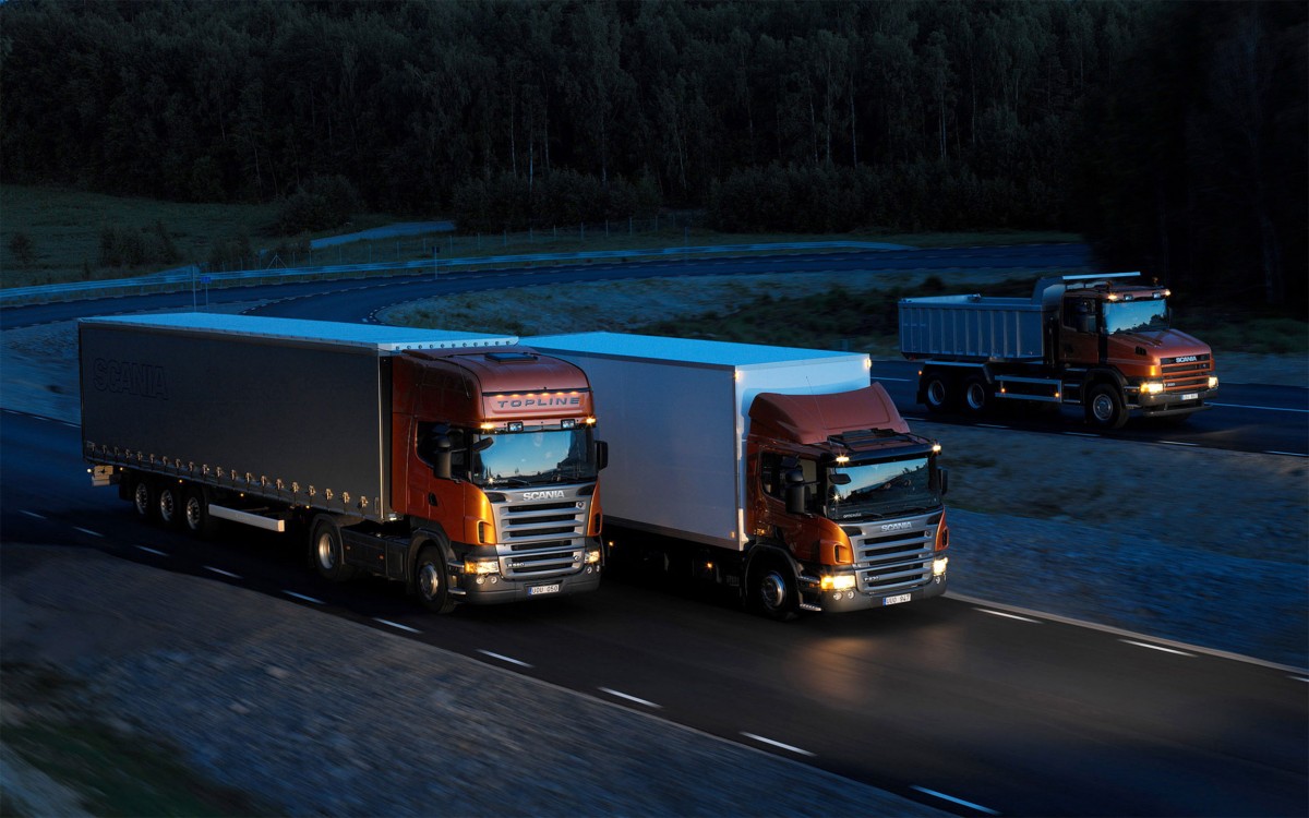 http://cargo.bold-themes.com/transport-company/wp-content/uploads/sites/2/2015/09/Three-orange-Scania-trucks-1200x750.jpg