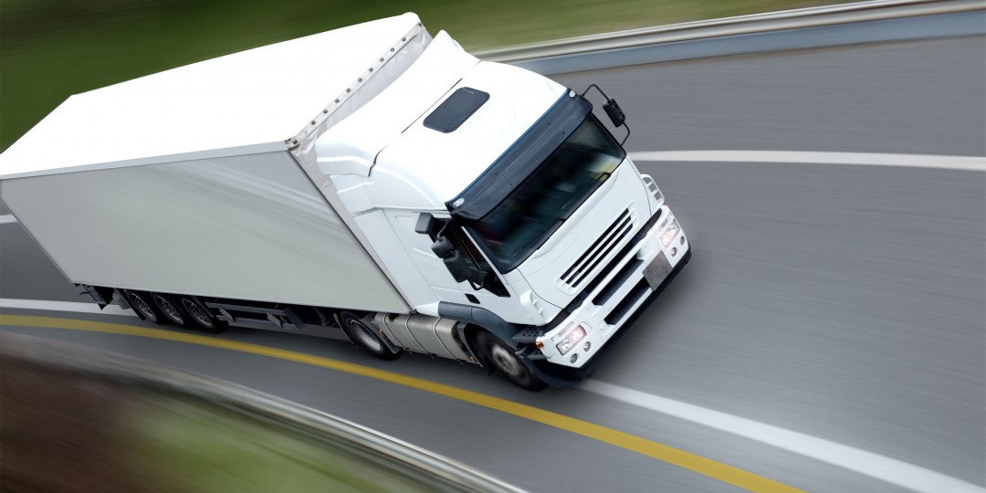 http://cargo.bold-themes.com/transport-company/wp-content/uploads/sites/2/2015/09/White-truck-on-top-1080x540.jpg